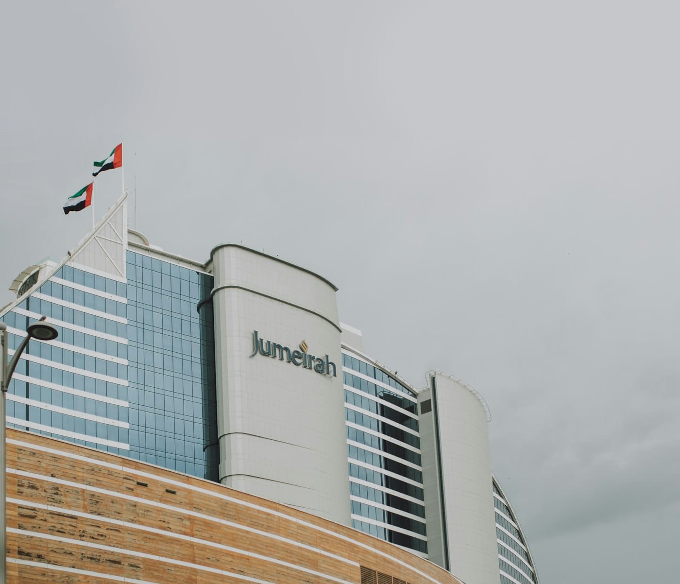 a tall building with a flag on top of it