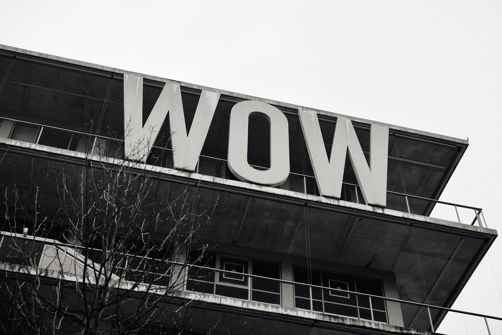 Black and white building with a large 'wow' sign