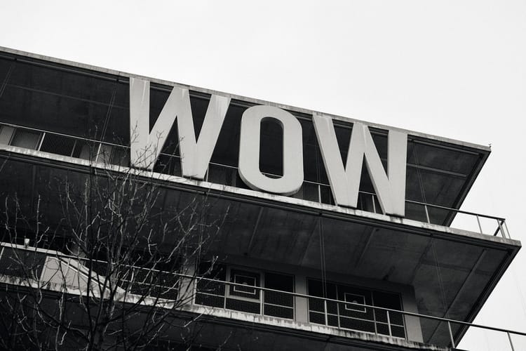 Black and white building with a large 'wow' sign